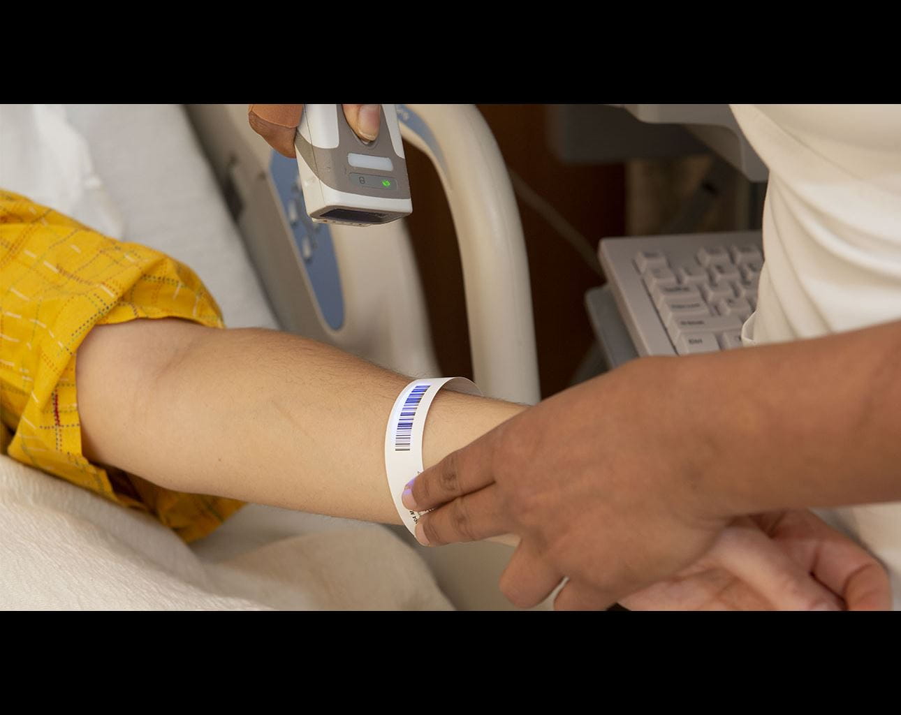 patient wrist band being scanned