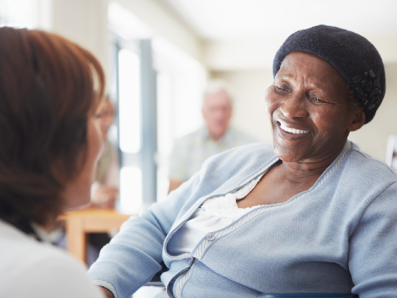 a senior patient talking with a loved one