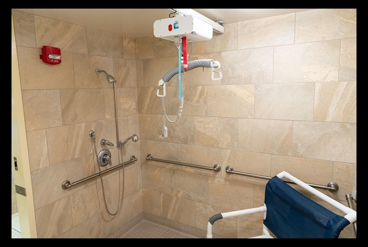 Showers are handicap accessible, with safety and comfort amenities to accommodate residents’ needs.