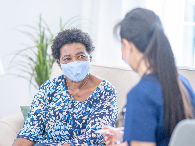 a female patient talking to a provider