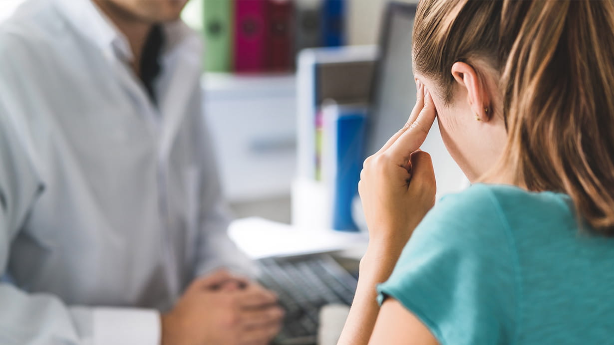 A woman experiencing head pains and visiting the Epilepsy Center