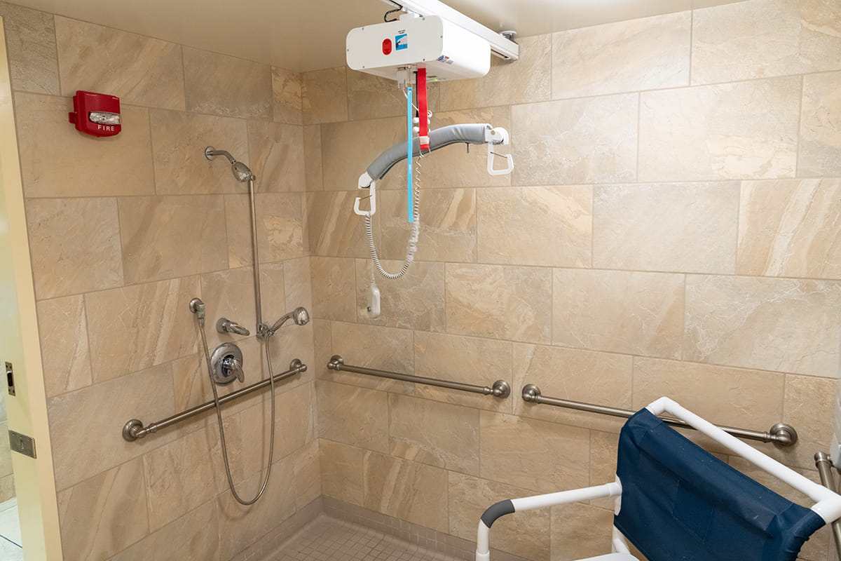 Showers are handicap accessible, with safety and comfort amenities to accommodate residents’ needs.